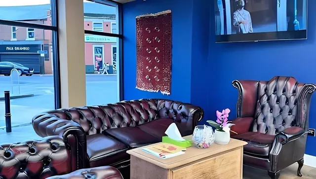 The leather sofa in the waiting area at Miss Bramhall